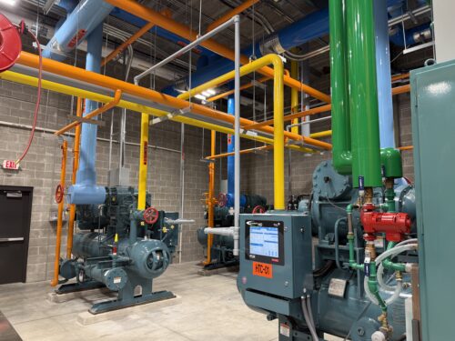 Multiple compressors with accessible motors, valves, and piping